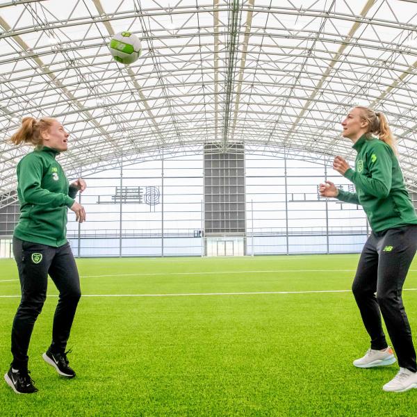 women playing football